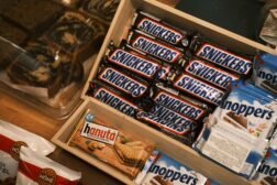 A shelf filled with snacks and other items