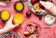 person holding yellow round fruit